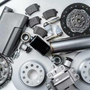 new metal auto parts on grey background.jpg